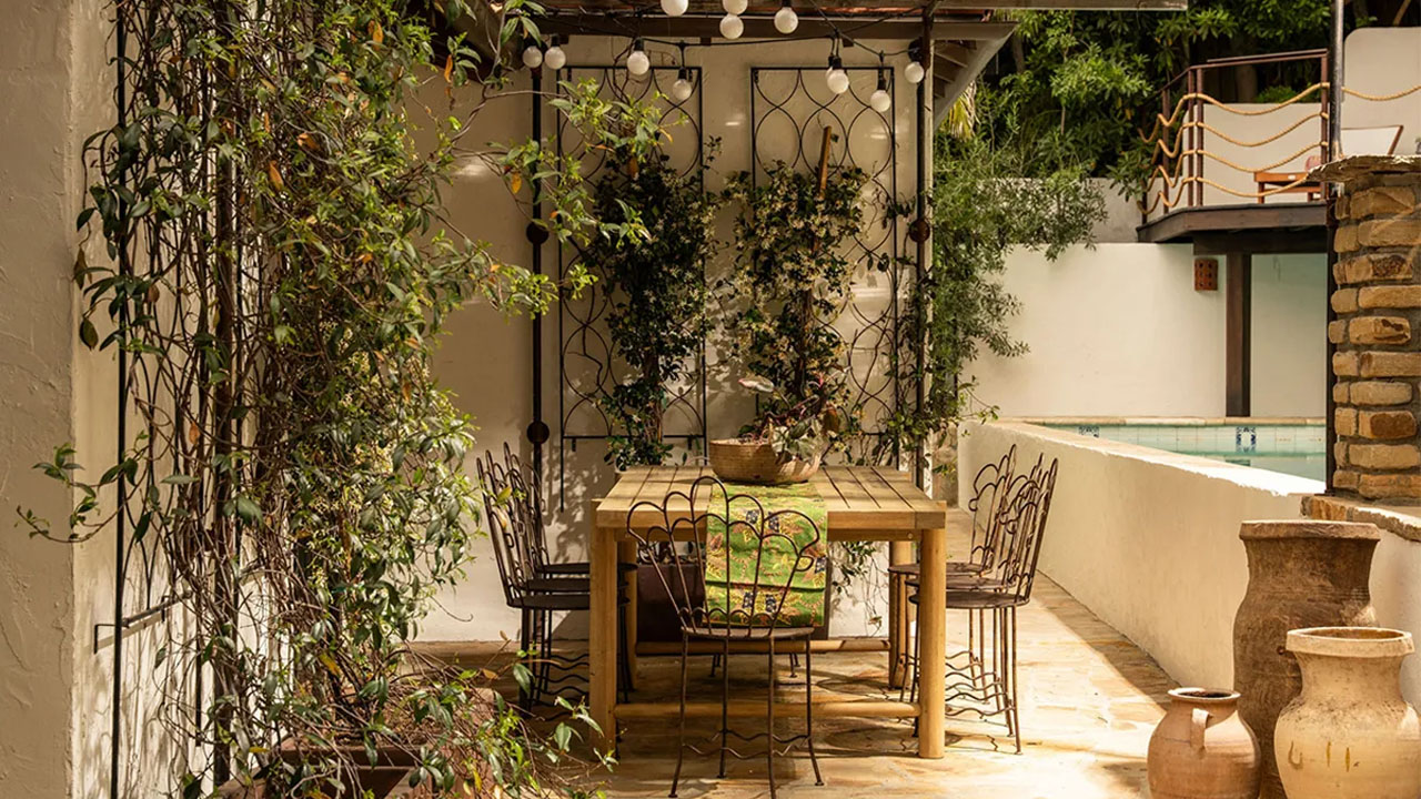 Outdoor dining space with jasmine flower wall