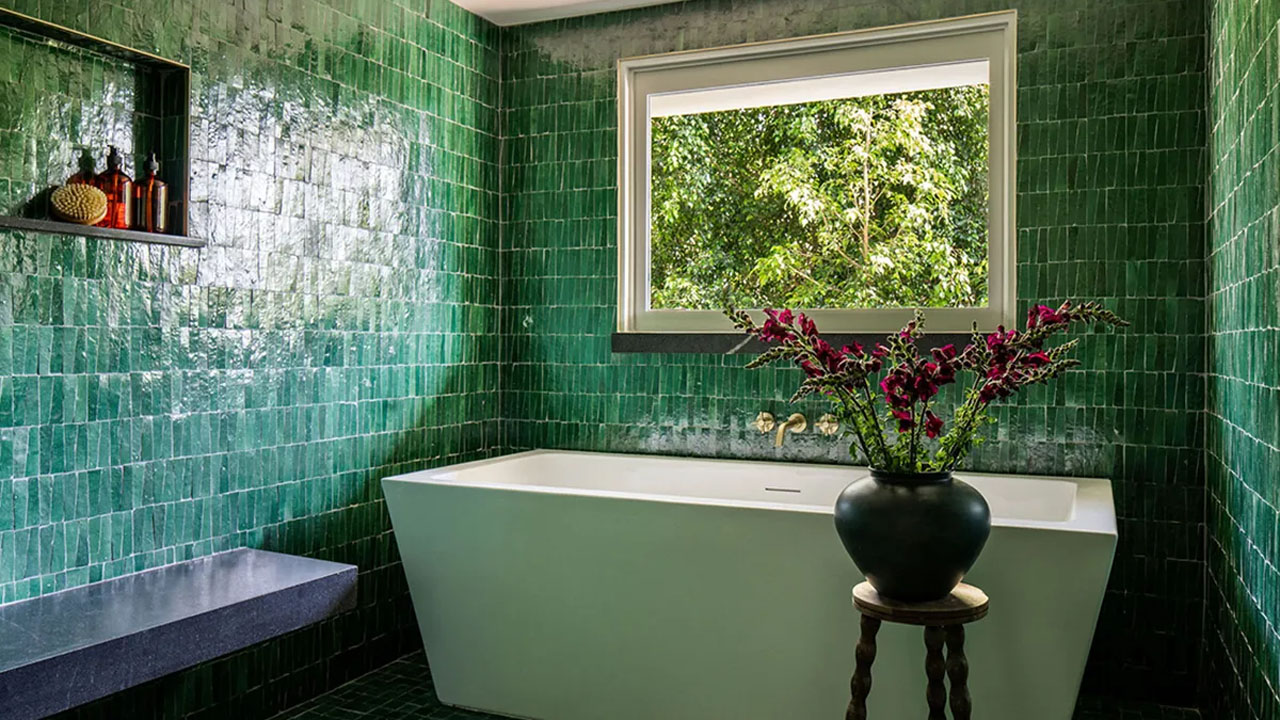 Marbled bathroom covered in stunning emerald Zia tiles
