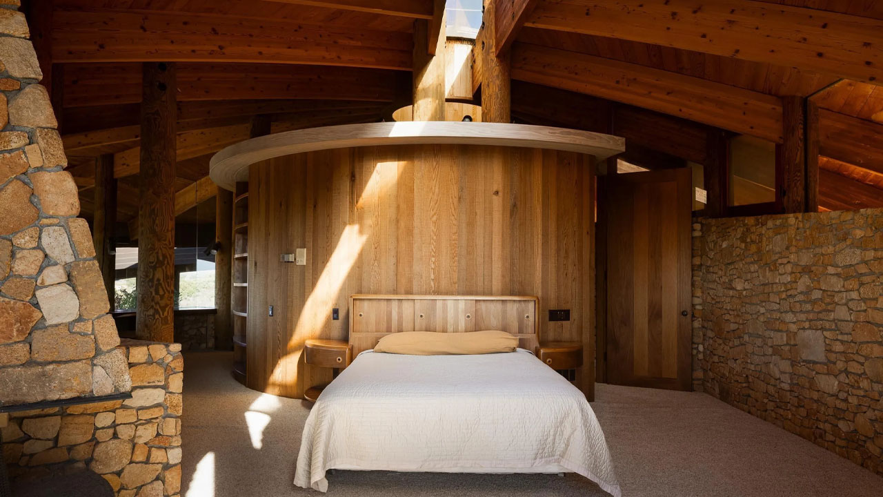 The spacious bedroom of the Old Castle Road House has ample sunlight