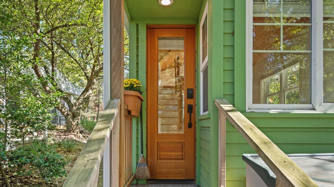 The honey-colored wooded door at entrance