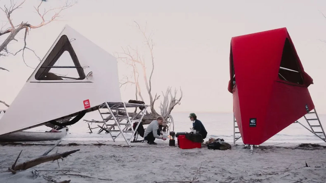 The bold-red and white canvas pops against natural setting