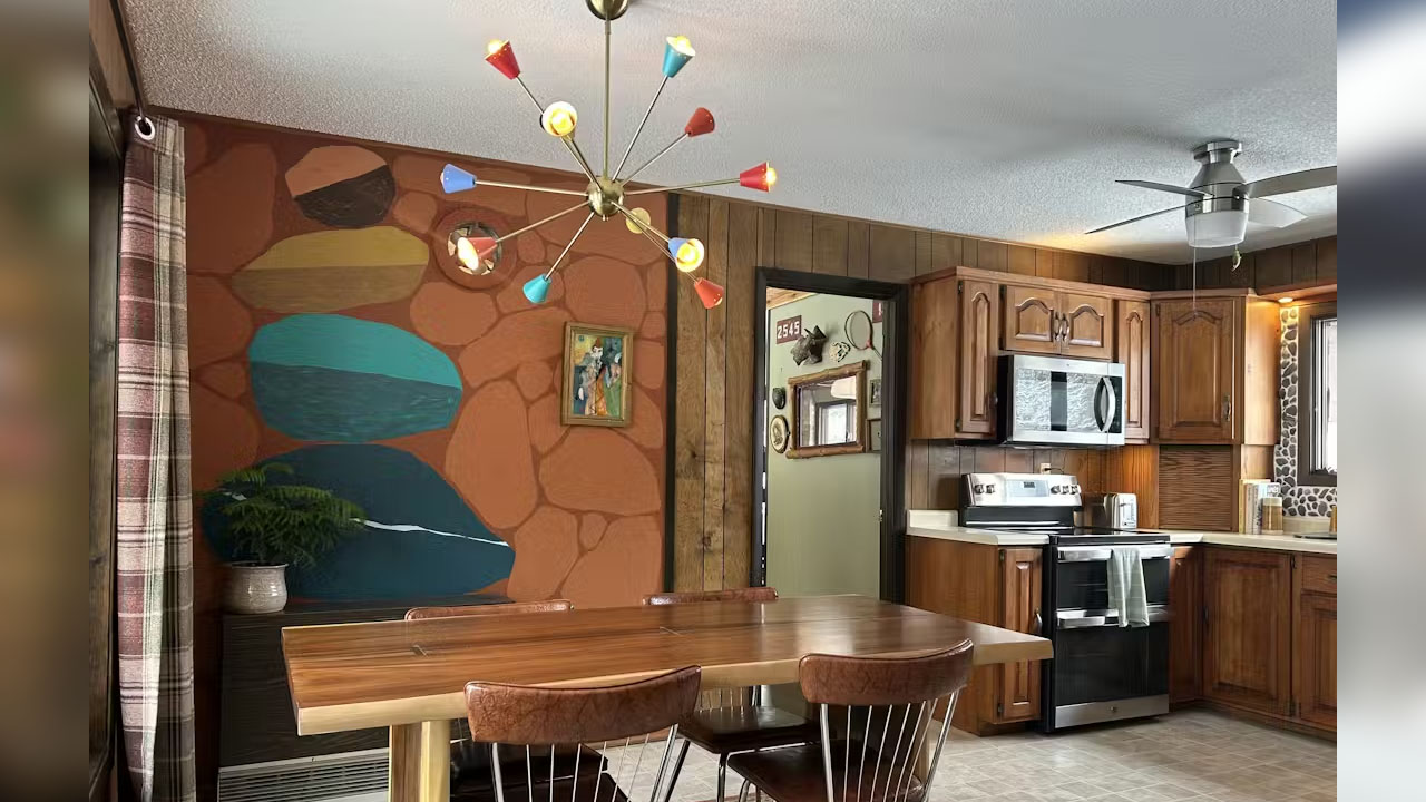 The stone-stacked mural wall in the kitchen of Camp Green Pine