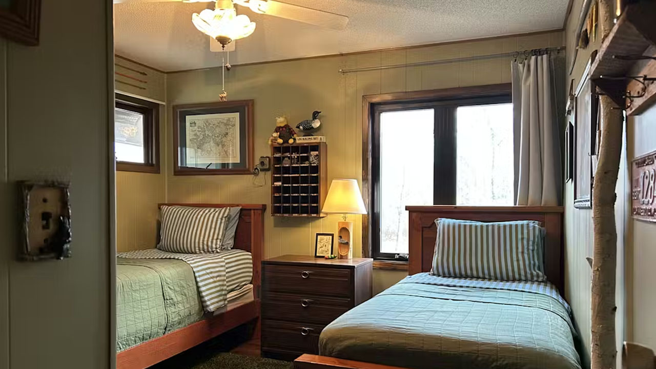 The cabin has multiple bedrooms.