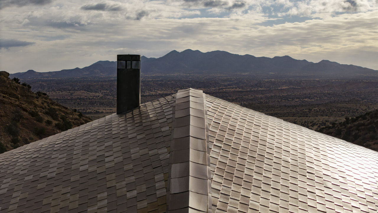 The handmade shingled roof mimics serpentine's glossy scales
