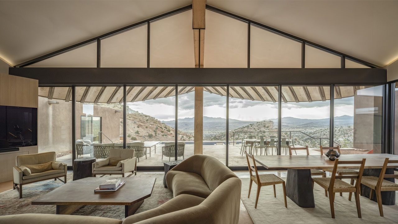 the glazed door frames the beautiful mountain picturesque view