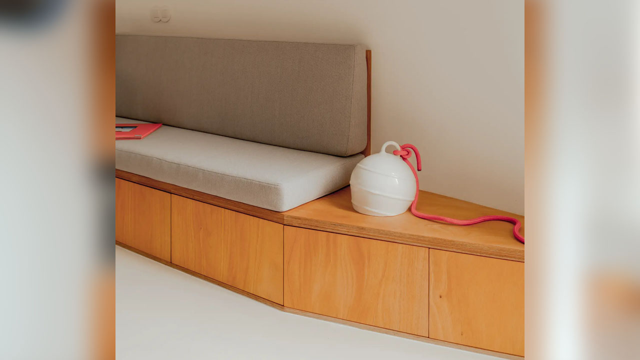 The storage-integrated seating follows curvature of the concrete tanks.