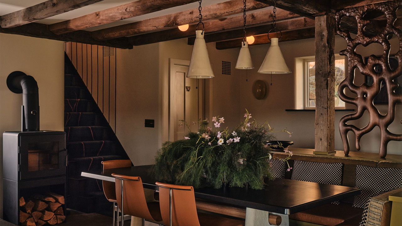 The dining table adorned with floral foliage