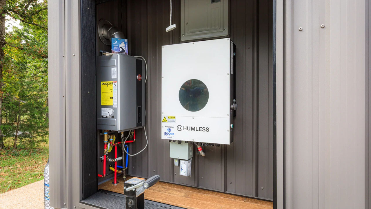 The utility shed conceals Humless hybrid inverter and Canadian Solar system