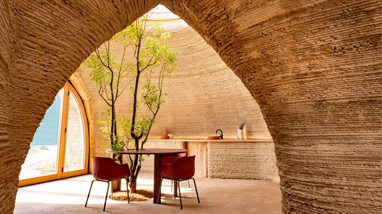 The built-in 3D printed furniture complement the textured walls and floor of 3D Printed Tecla House