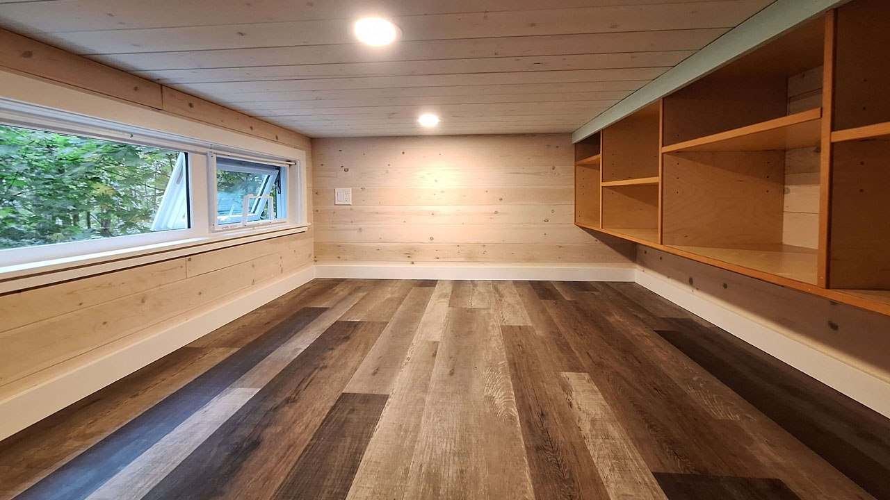 Spacious main floor bedroom of Brackenwood tiny house