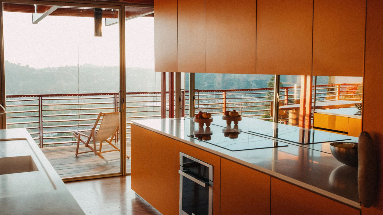 The yellow kitchen anchors the living space