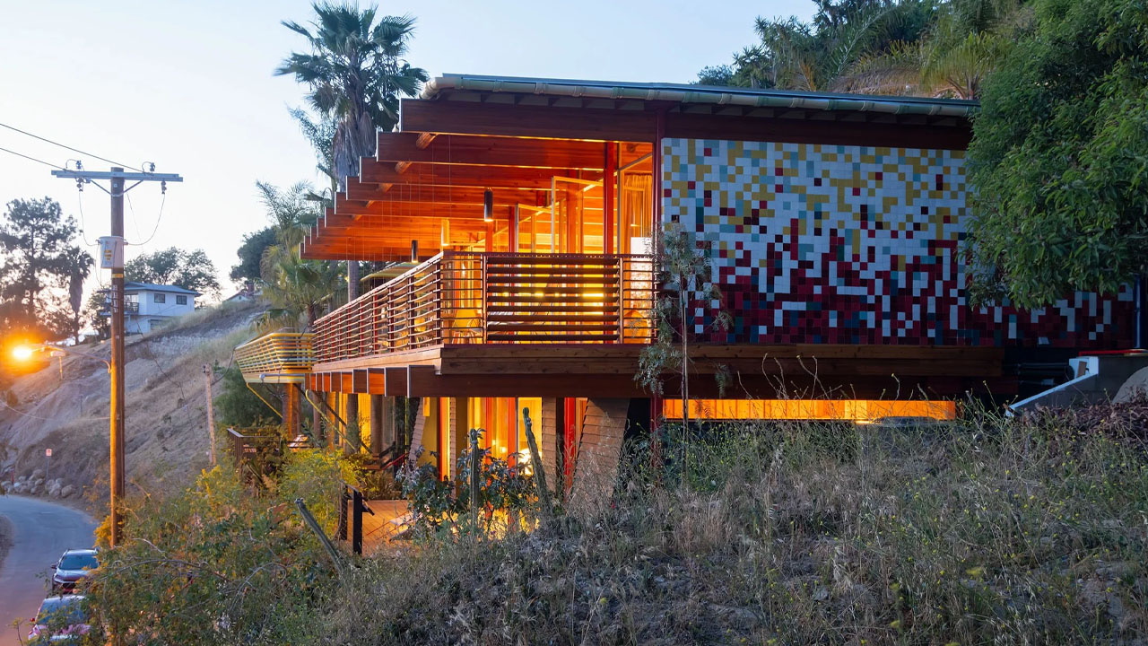 The mosaic tiled walls of cantilevered house