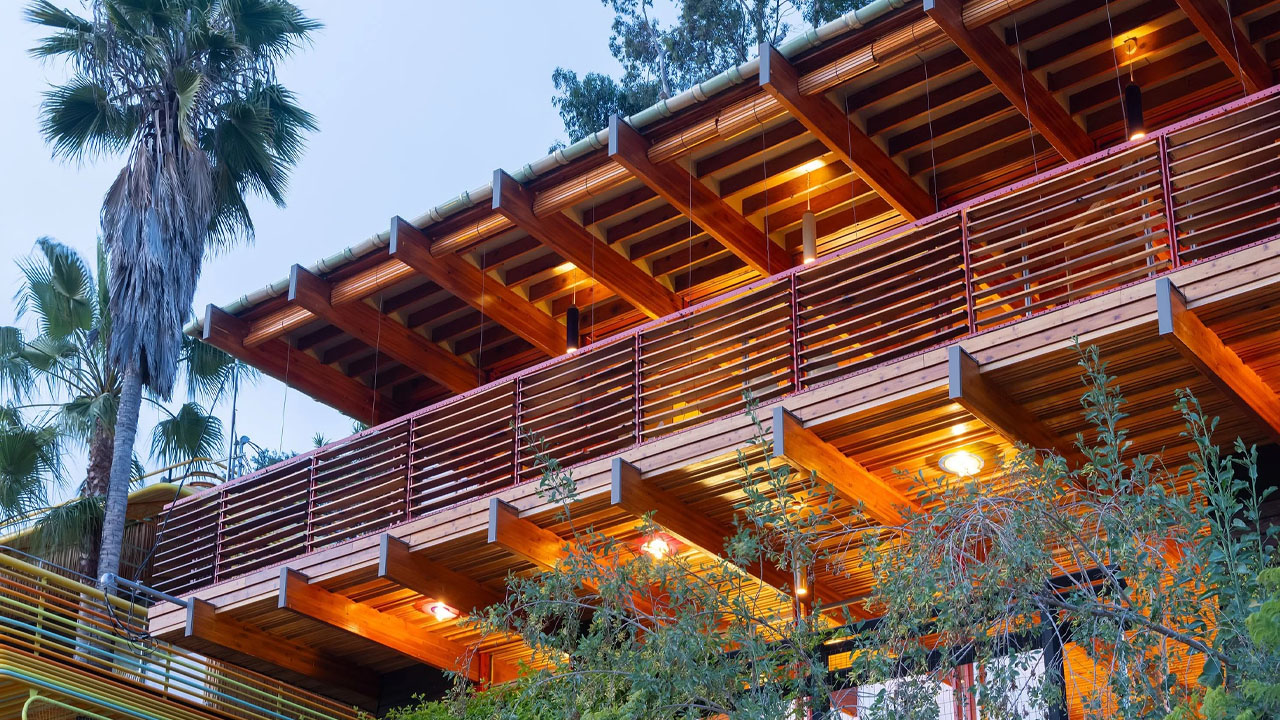 The exposed wooden beams and railings add modern rustic vibe to its facade.