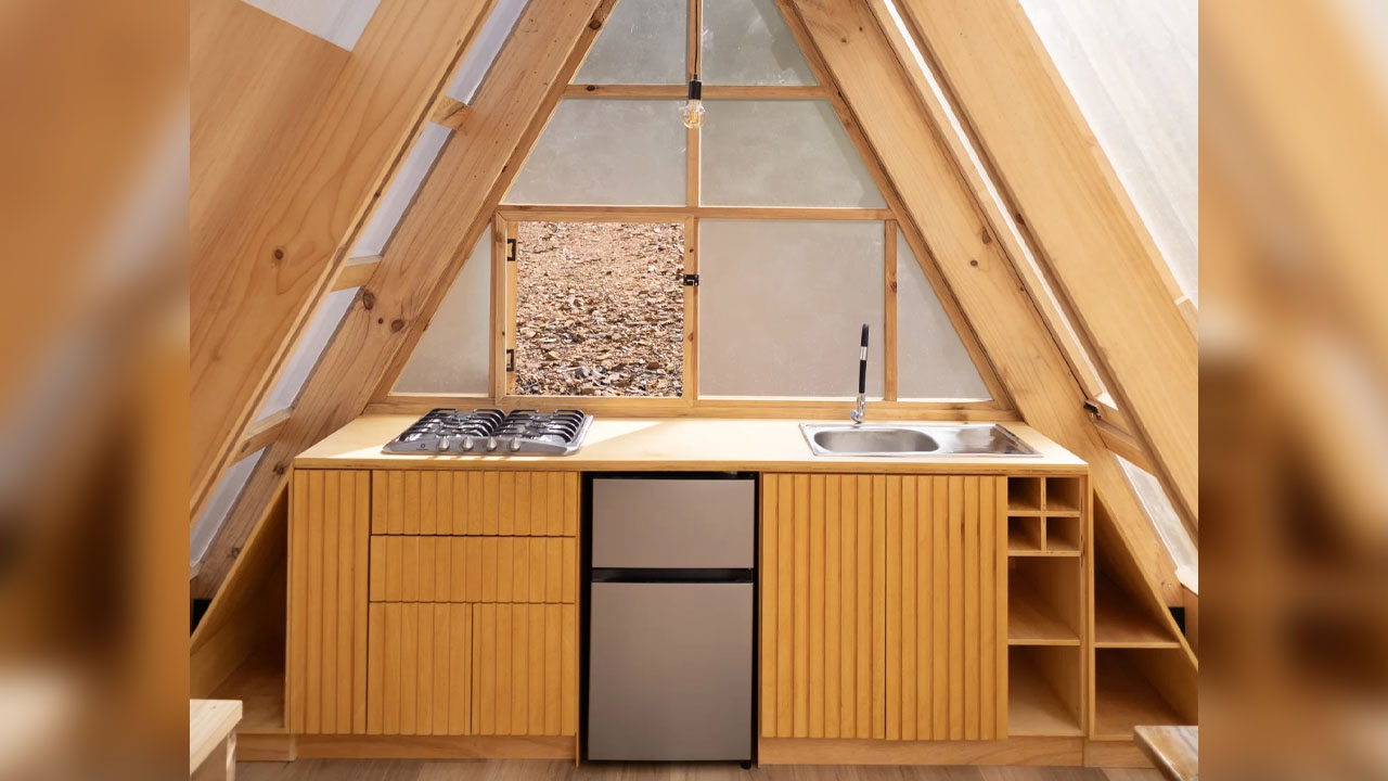 Lovely ribbed pattern created by the vertical wooden planks in Kitchen cabinetry