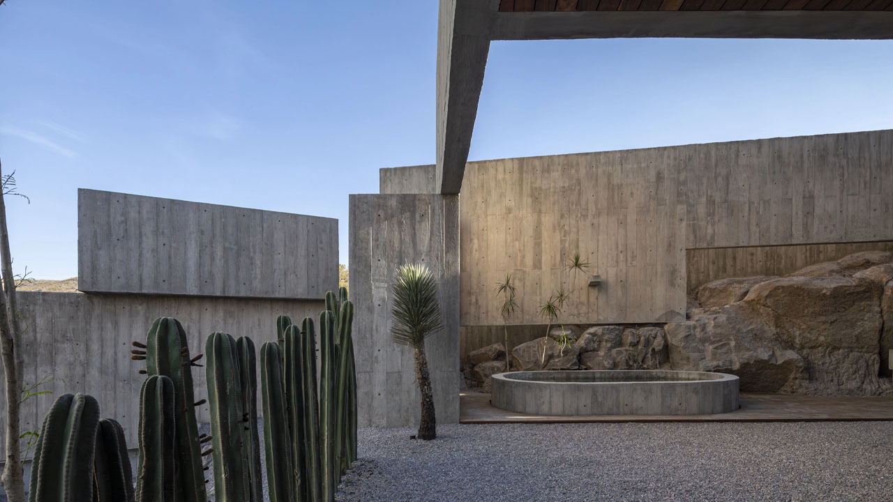 Cacti and rocks integrated into the architecture of Casa Eco house