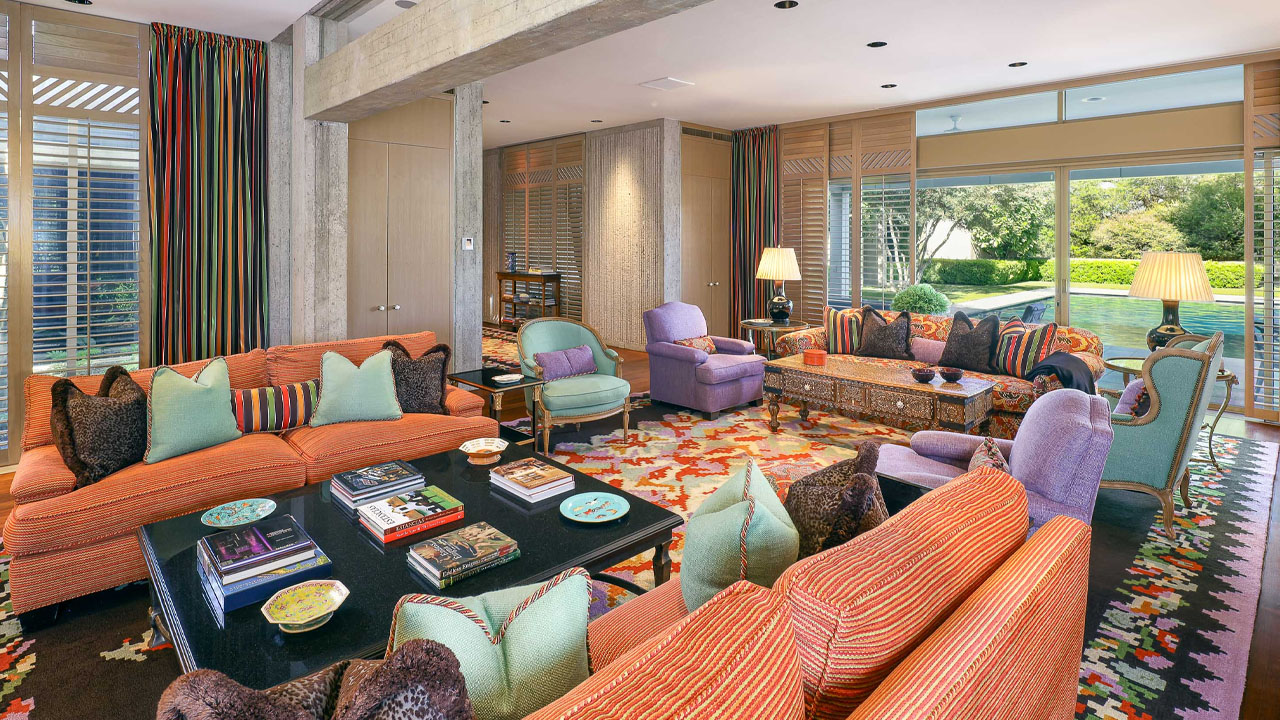 The whimsical pattern and vividness of the upholstery in living area