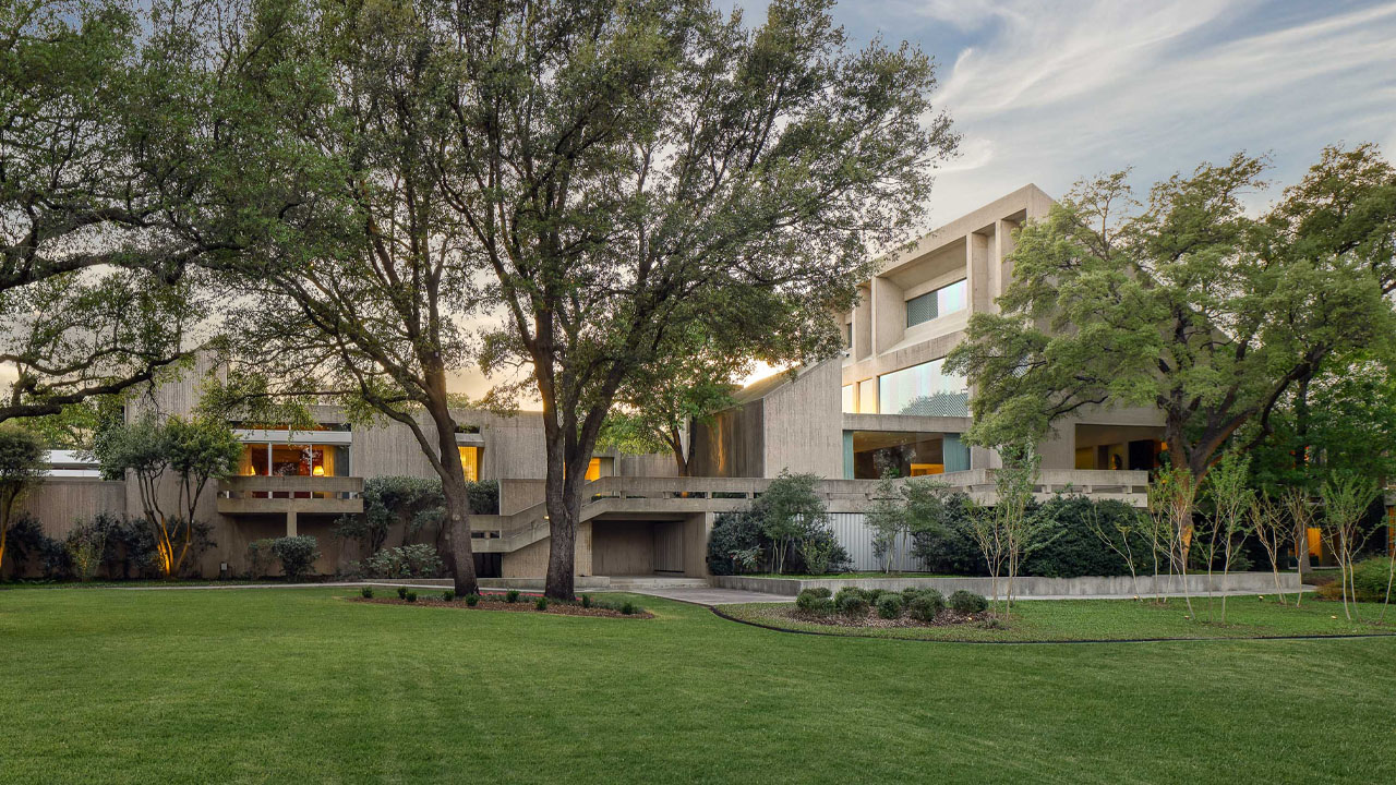 The lush lawn and Oak trees surrounding the residence