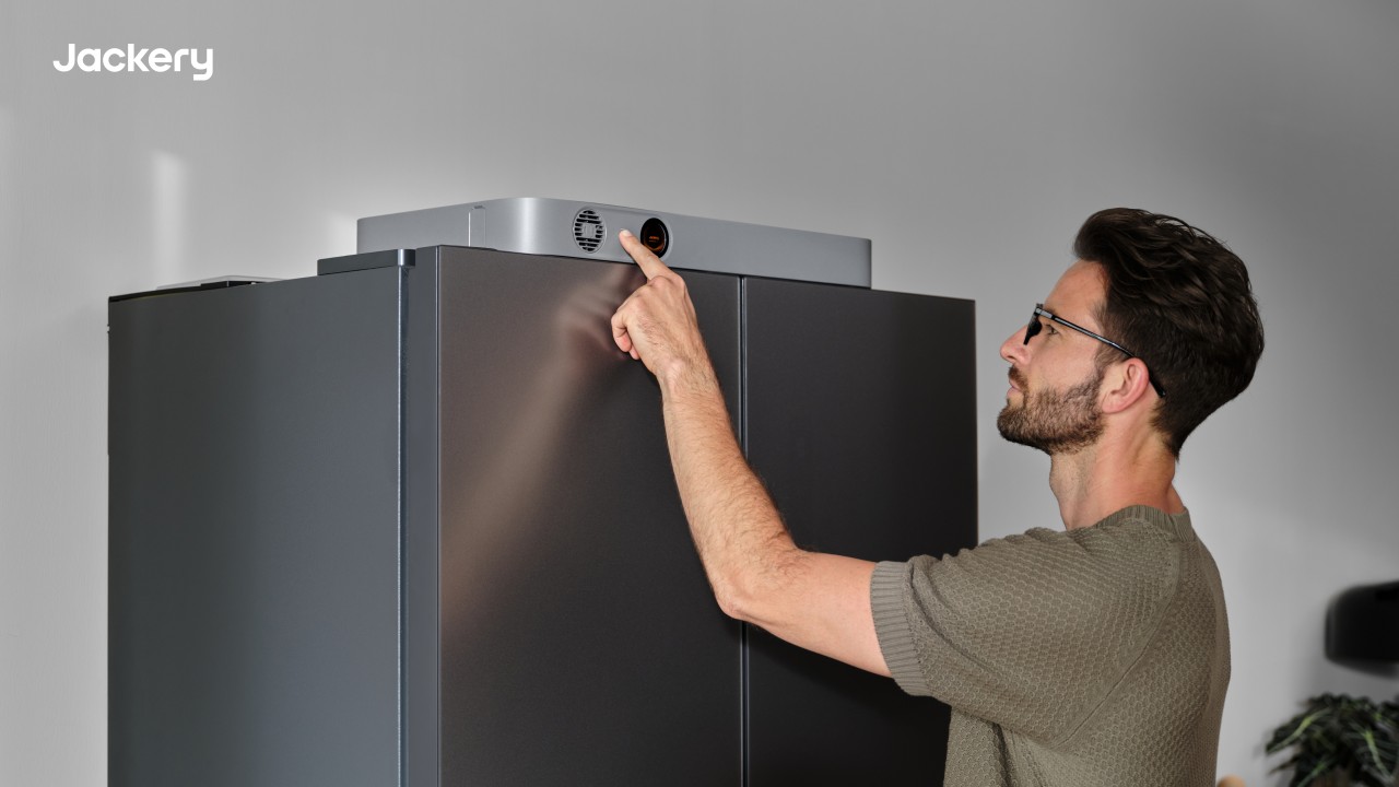 Jackery FridgeGuard placed on top of the fridge