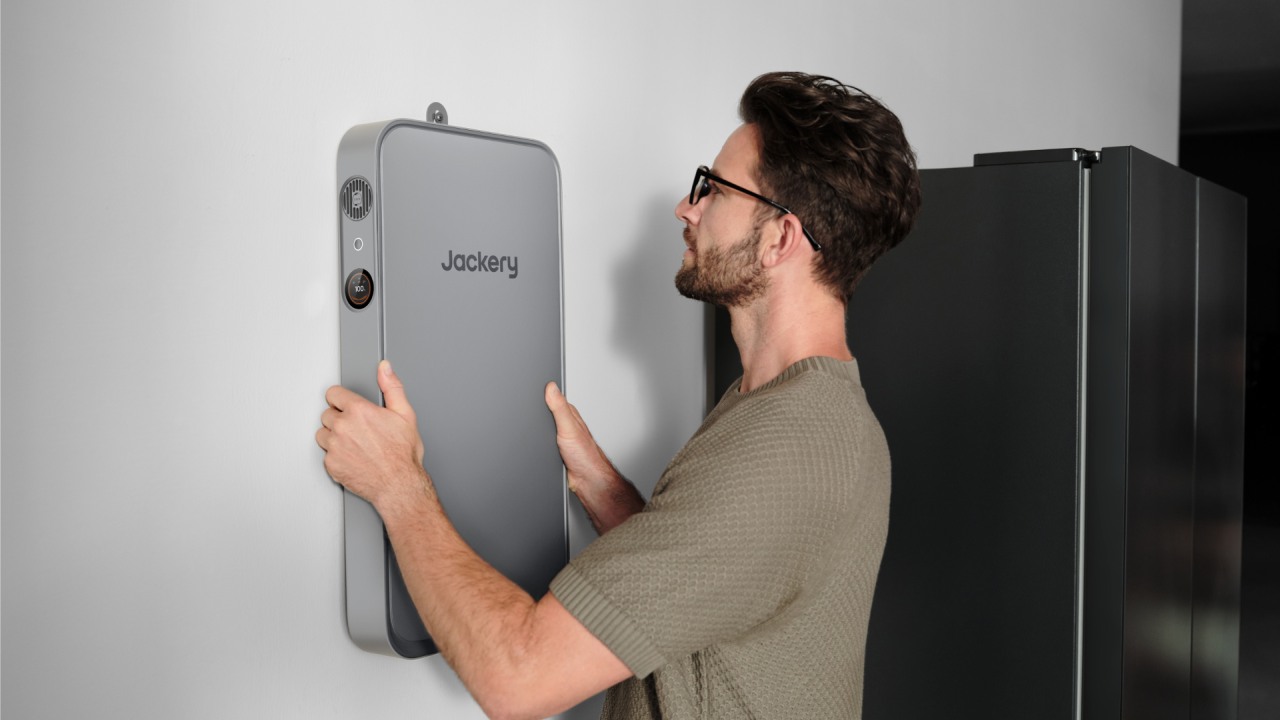 Jackery FridgeGuard backup battery being installed on wall