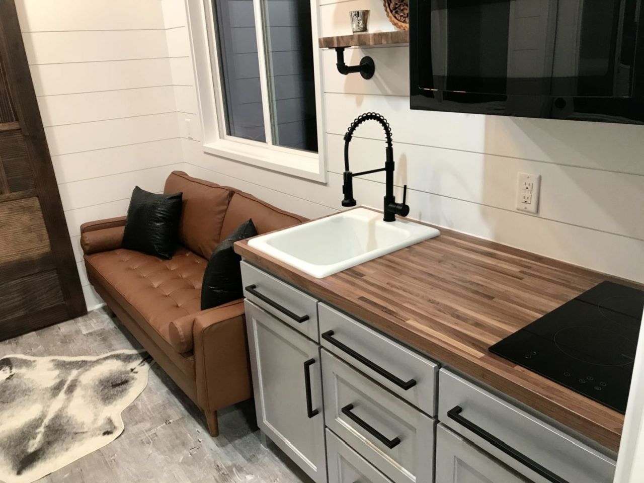 Living room and kitchen of Jay tiny house in USA