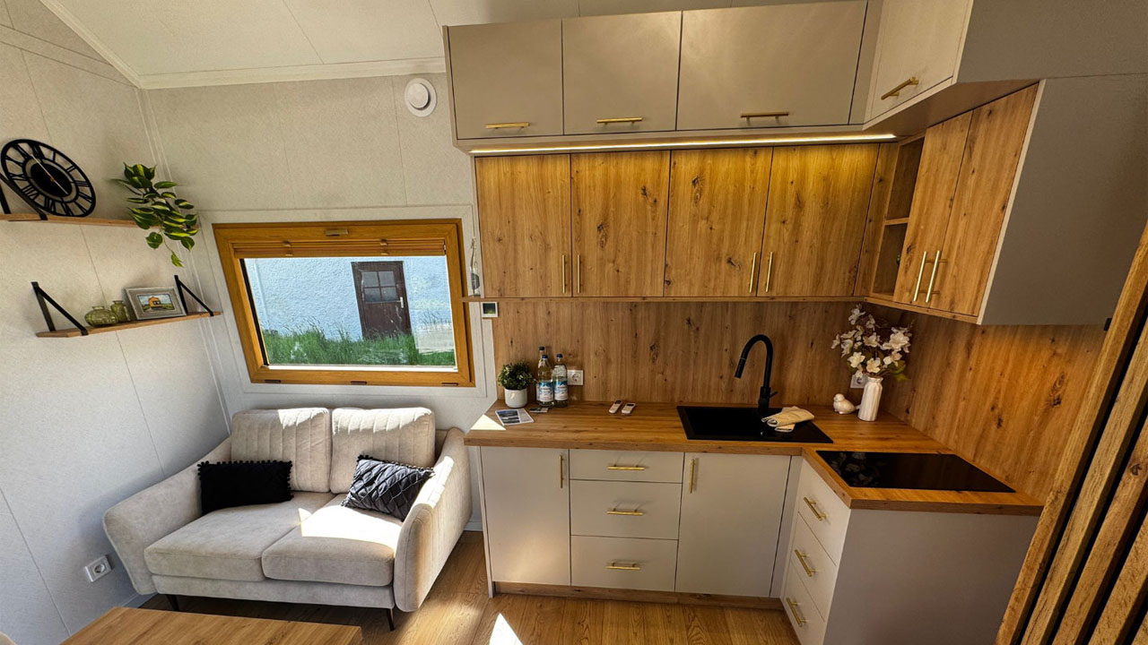The L-shaped kitchen and sofa