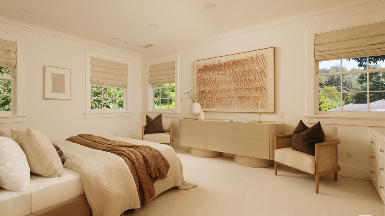 The soft carpet makes bedroom appear cozy and warm