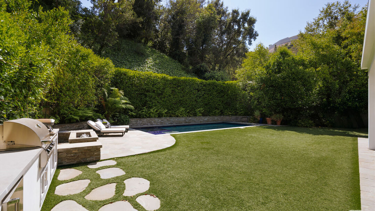 The tall hedges maintain the privacy