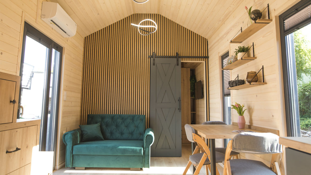 The vertical slatted wood panel clad wall