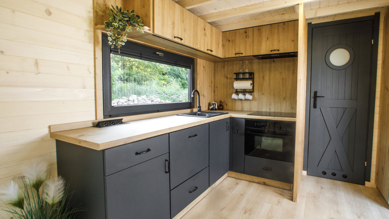The charcoal grey finish on the cabinetry