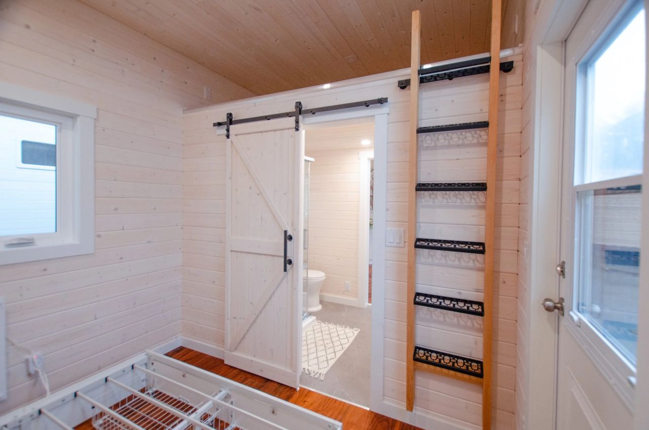 Ladder leading to loft of Rose tiny house