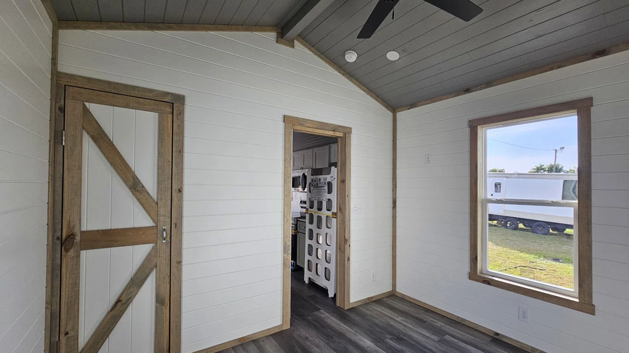 The barn house style doors enhance aesthetic of living space