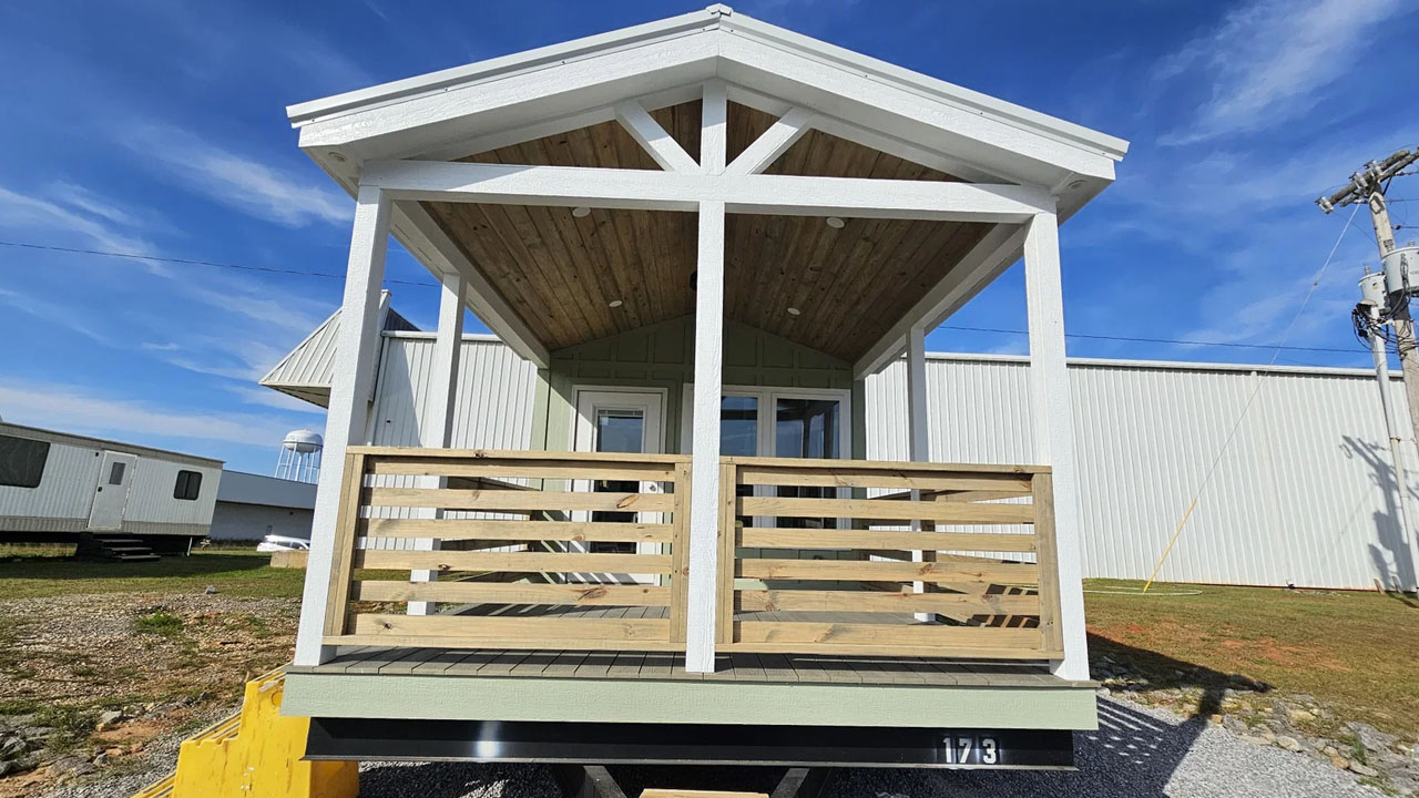 The white king post truss adorns the A-frame gable roof