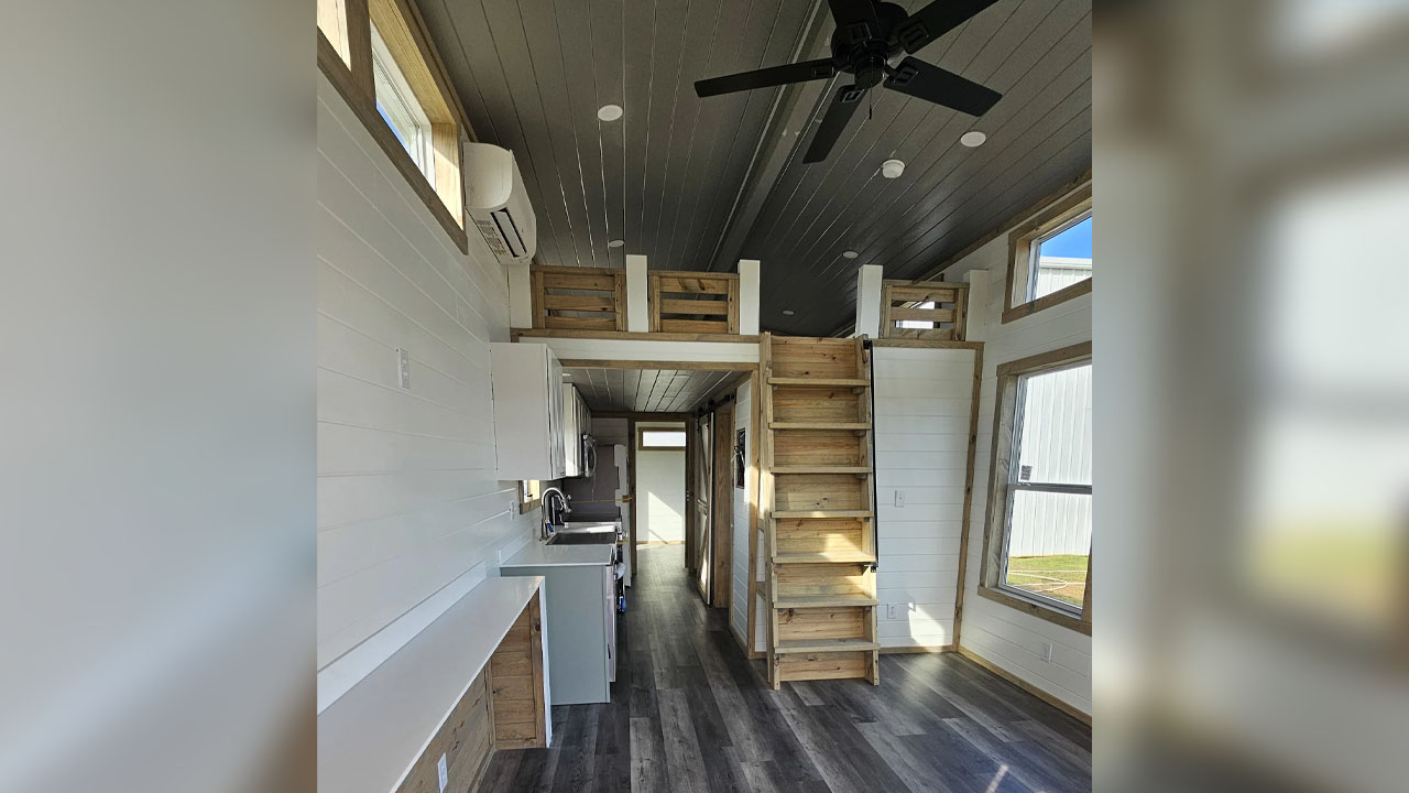 The luxurious wood-wrapped interior of the Rustic Roost tiny house
