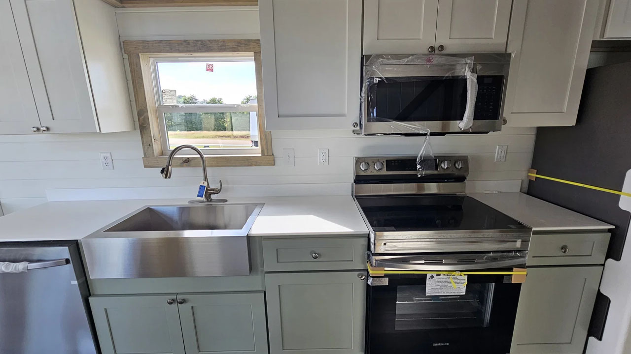 The dual tone cabinetry in the kitchen