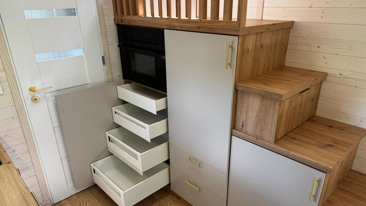 The generous storage fits microwave, storage drawers and refrigerator