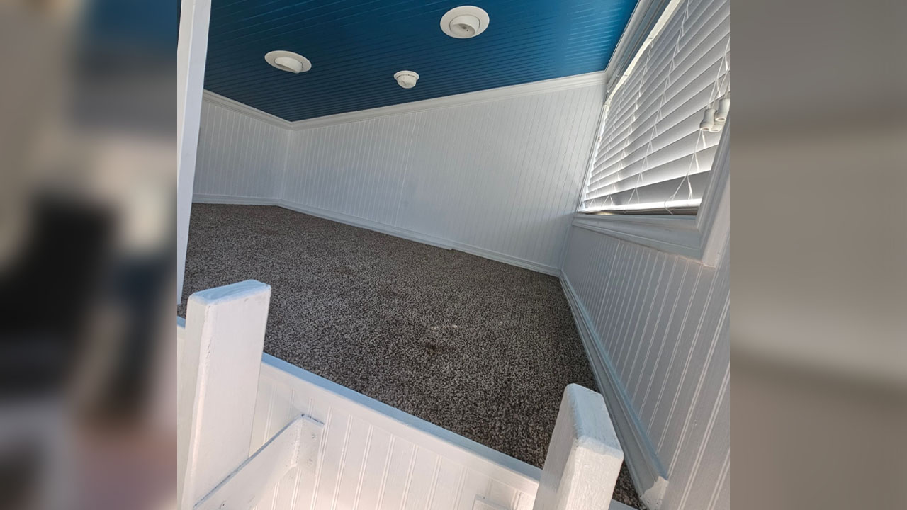 The loft bedroom of Sunny Skillion tiny house