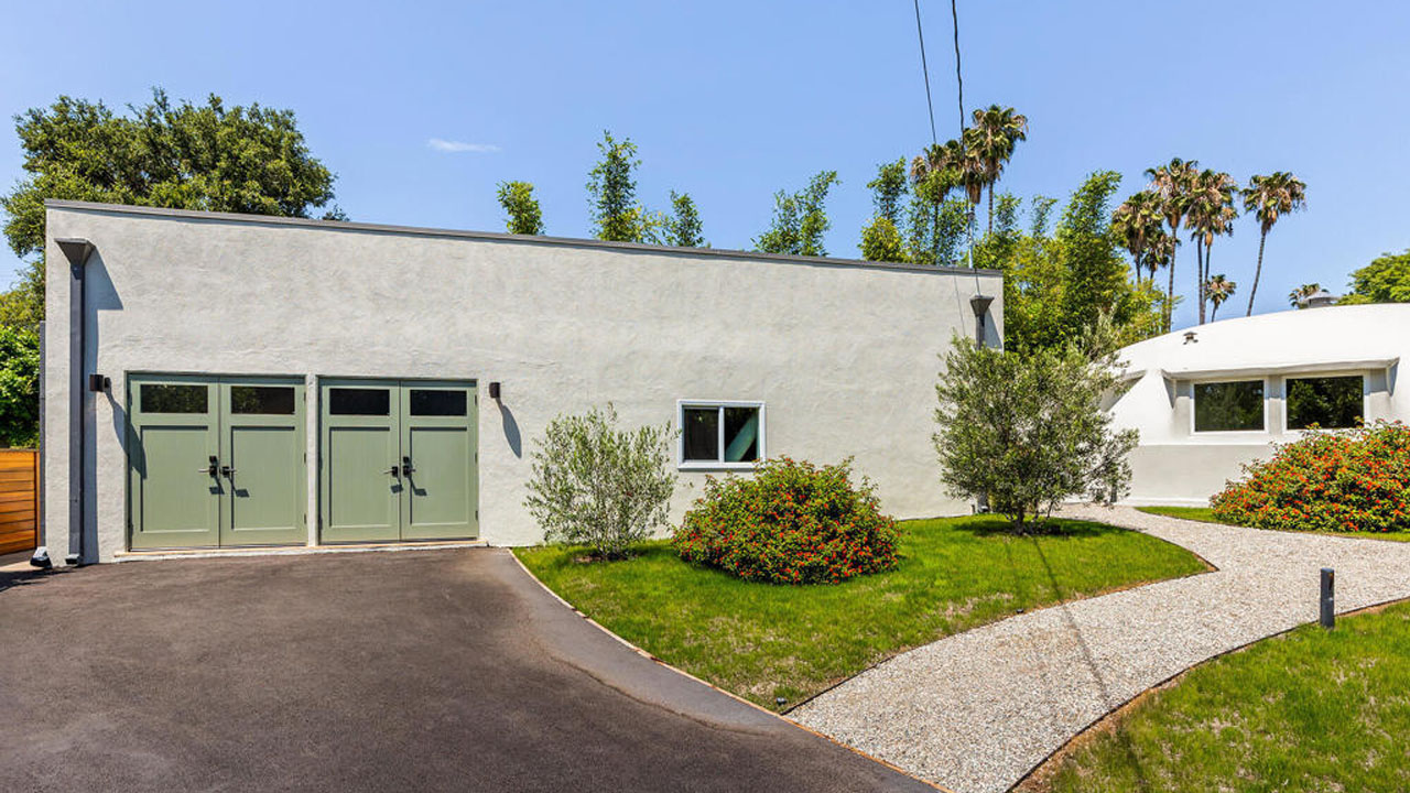 The detached studio serves as a guest house