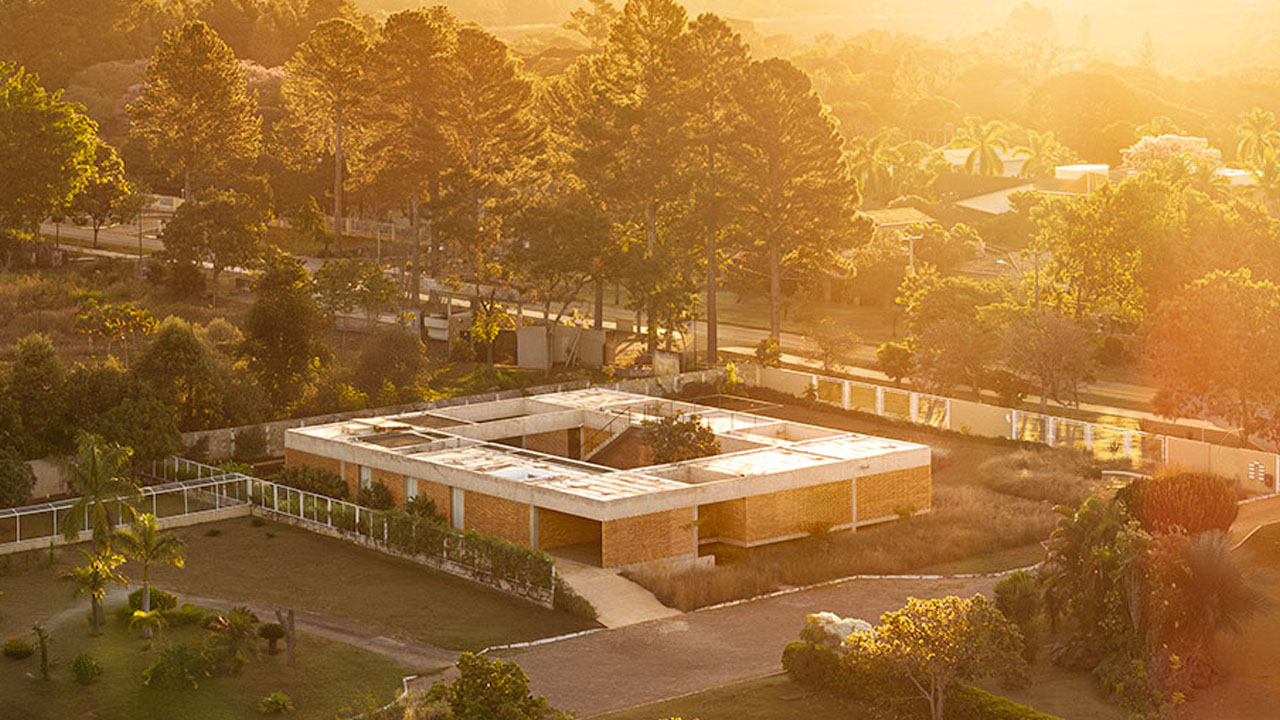 The warm sunlight giving a golden glow to the Tupin house