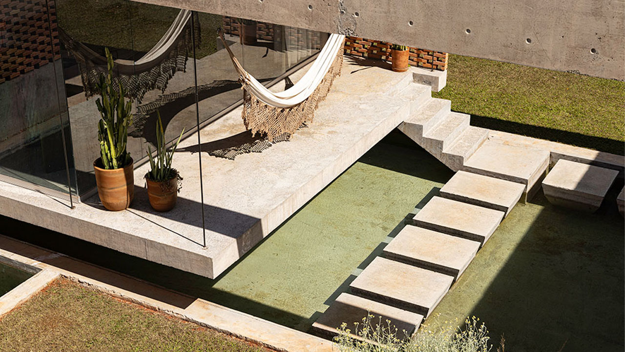 Concrete slabs leading to interior and hammock hanging ear entrance