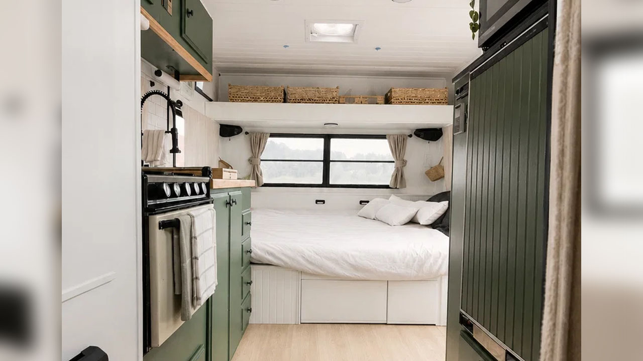 The double bed near the kitchenette