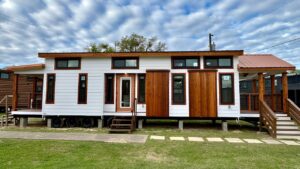 Austin Tiny House Packs Fireplace and Island Kitchen Between Two Porches Austin Tiny House exterior