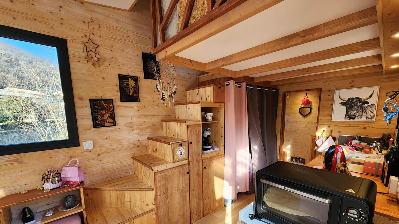 Camille tiny house-work trims adorn wood-clad interior