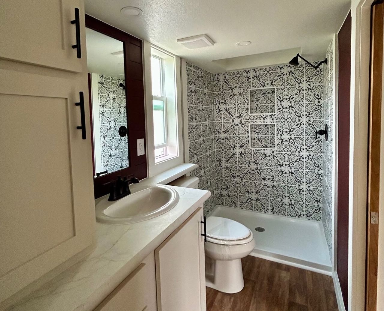 Shower and Vanity inside Cardinal Tiny House Park Model