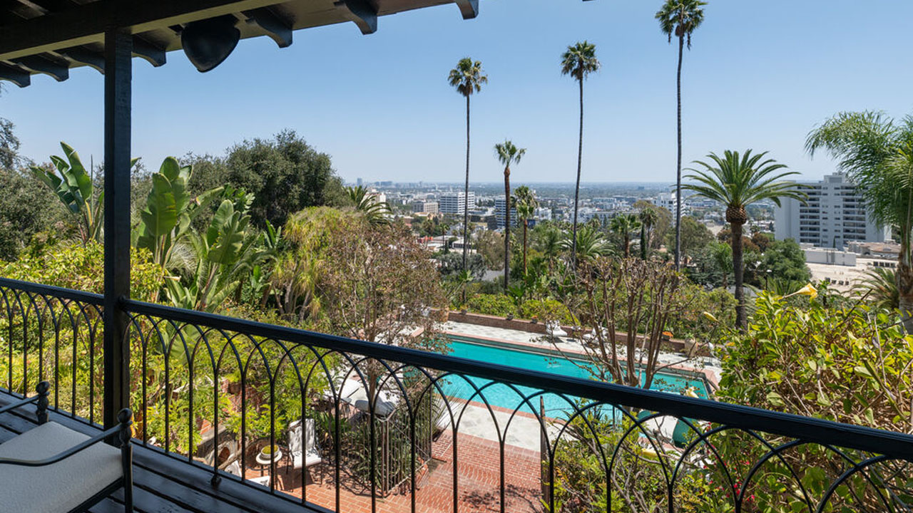 Helen Mirren’s Hollywood Hills Estate-balcony overlooks pool and Hollywood hills