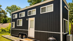 Farmhouse-Style Lake Lanier Tiny House Offers 300 sq. ft. of Flexible Layout Lake Lanier tiny house on wheels with farmhouse-style aesthetics