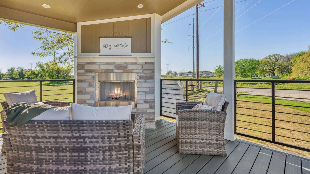 Liberty Landing Tiny House Park Model porch with fireplace