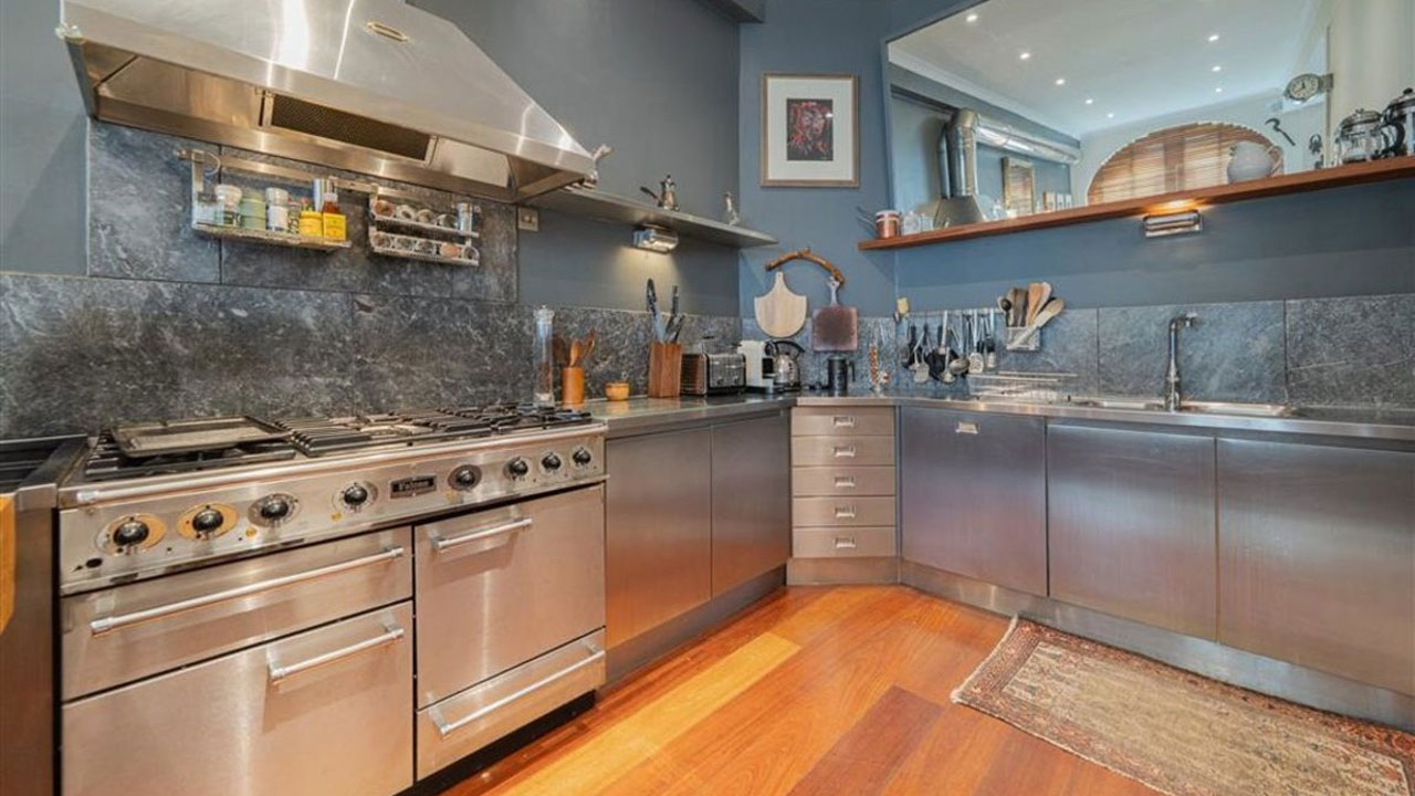 Madonna and Guy Ritchie’s Former London House- stainless steel kitchen