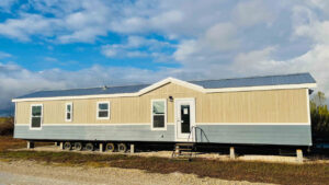 Extra-Wide Maverick Tiny House Packs Two Full Bedrooms and Two Baths in 60 Ft. Exterior of Maverick tiny house Park Model