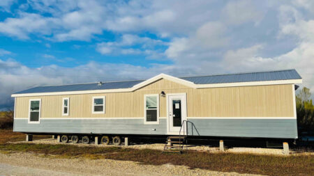 Extra-Wide Maverick Tiny House Packs Two Full Bedrooms and Two Baths in 60 Ft. Exterior of Maverick tiny house Park Model