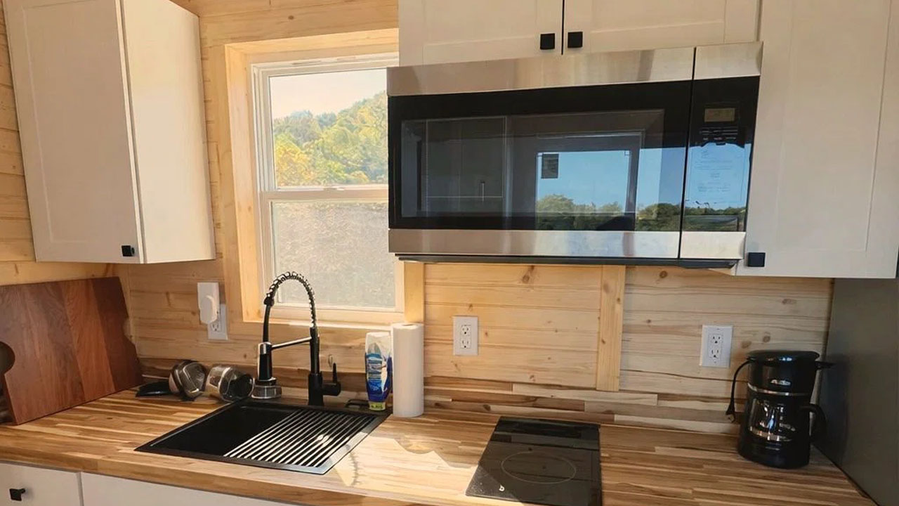 Meadow Cottage on Wheels-microwave integrated into the cabinets